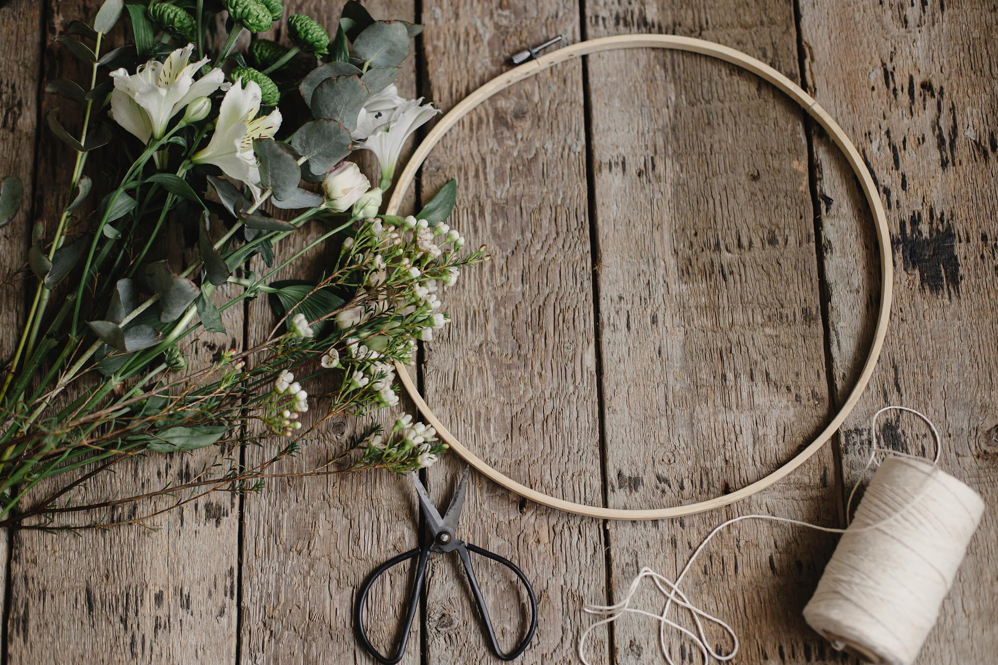 Embroidery hoop with floral design on linen